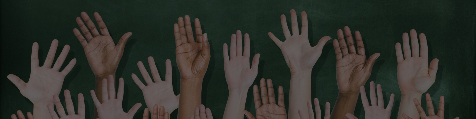 Hands raised in a classroom